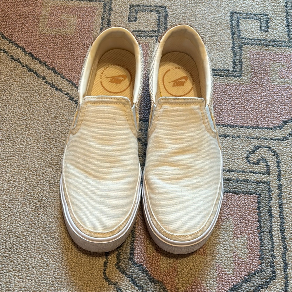 Cream colored Nike Slip-ons with cork detailing in back. 6.5, great used cond